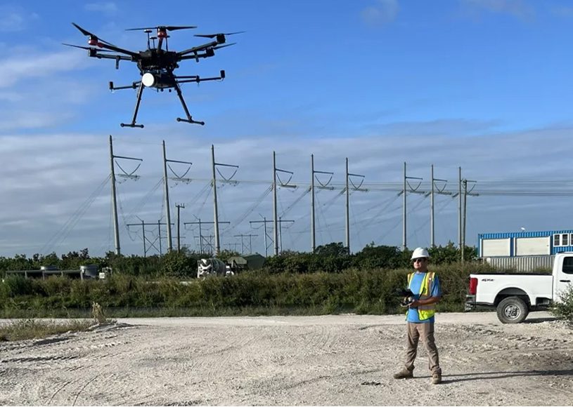Drone operator in construction area with drone.